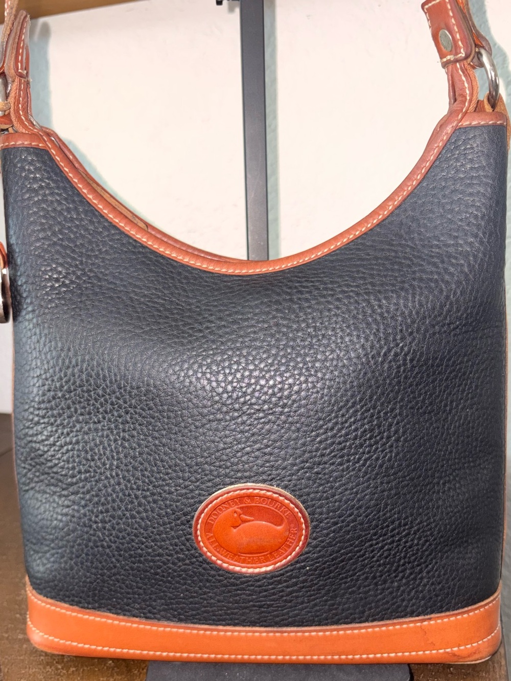 Dooney & Bourke Black Pebbled Leather Shoulder Bag with Brown Trim